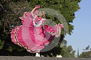 Mexican folk dancer with traditional costume photo