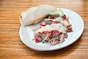 Mexican food, Alambre is made with Beef, onion, bacon, chili, cheese and tortillas in Mexico photo