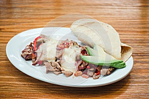 Mexican food, Alambre is made with Beef, onion, bacon, chili, cheese and tortillas in Mexico photo