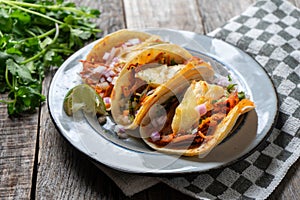 Mexican food: Authentic tacos al pastor with lime and pineapple