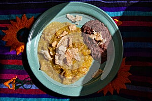 Mexican food Chicharron with green sauce and refried beans