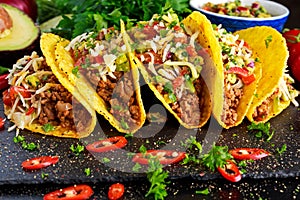 Mexican food - delicious taco shells with ground beef and home made salsa