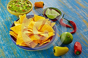 Mexican food nachos with guacamole chili peppers