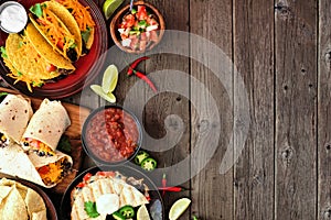 Mexican food side border, above view on a dark wood background with copy space