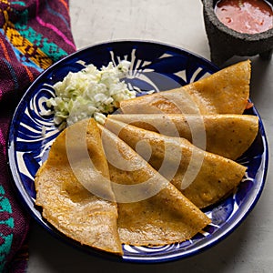 Mexican food. Steamed tacos also called de canasta on grey background