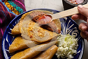 Mexican food. Steamed tacos also called de canasta on grey background photo