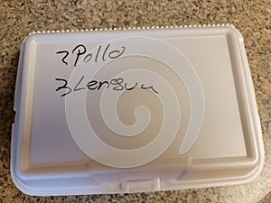 mexican food take out box saying 2 pollo chicken and 3 lengua tongue