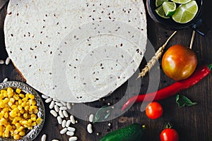 Mexican food - tortilla with vegetables, corn and beans.