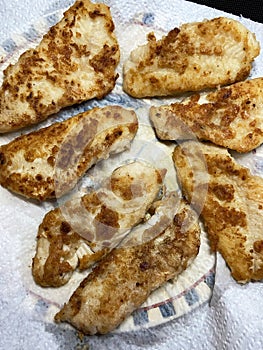 Mexican Fried Garlic Fish Draining on a Paper Towel