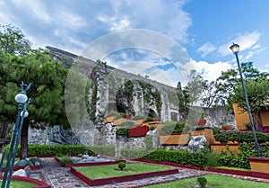 Mexican garden and colonial building photo