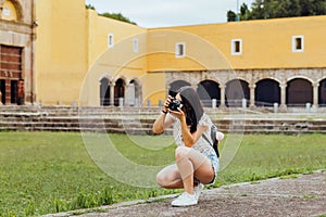 Mexican girl with camara, Female photographer taking pictures on South America in vacations photo