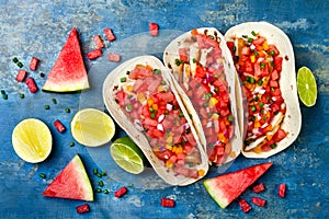 Mexican grilled chicken tacos with watermelon salsa.