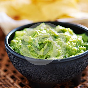 Mexican guacamole in molcajete bowl