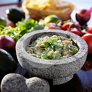 Mexican guacamole in stone molcajete