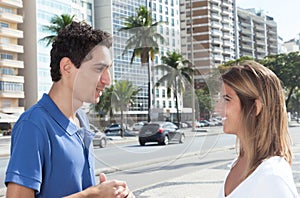 Mexican guy talking with girlfriend in the city