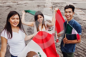 Mexican guys cheering Viva Mexico on independence day in Mexico