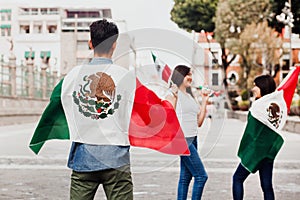 Mexican guys cheering Viva Mexico on independence day in Mexico