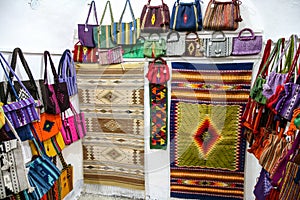 Mexican hand made woven carpets and bags with mexican ornament