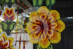 Mexican Huichol Beaded Chaquira Flower Necklaces in the market handmade crafts very laborious photo