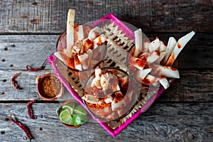 Mexican jicama fruit cutted with lime, chili powder and chamoy