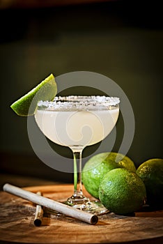 Mexican lemon lime margarita cocktail drink in bar