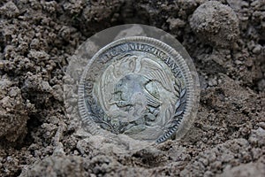 1843 Mexican Libertad Silver Coin on Ground in Dirt Back View