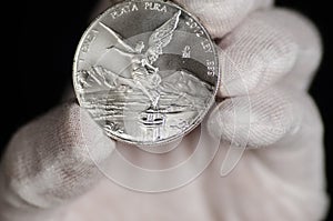 Mexican Libertad Silver Coin hand held photo