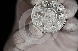 Mexican Libertad Silver Coin hand held photo