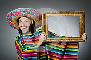 The mexican man with sombrero and picture frame