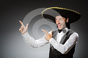 Mexican man wears sombrero isolated on the white