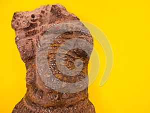 Mexican Mayan Aztec wood and ceramic mask on yellow background travel image Mexico Tenochtitlan, Teotihuacan photo