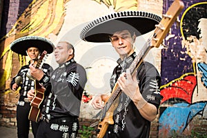 Mexican musicians in traditional costumes mariachi