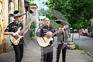 Mexican musicians in traditional costumes mariachi