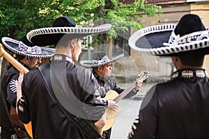 Mexican musicians in traditional costumes mariachi