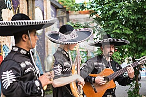 Mexican musicians in traditional costumes mariachi