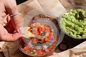 Mexican nacho chips salsa and guacamole