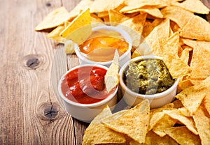 Mexican nachos corn chips with guacamole, salsa and cheese dip