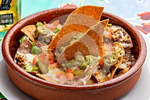 Mexican nachos rancheros with guacamole