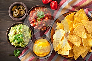 Mexican nachos tortilla chips with guacamole, salsa and cheese d