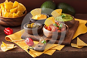 Mexican nachos tortilla chips with guacamole, salsa and cheese d