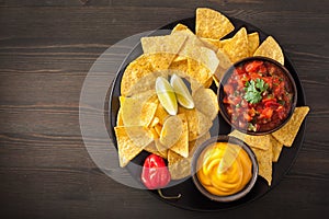 Mexican nachos tortilla chips with salsa and cheese dip