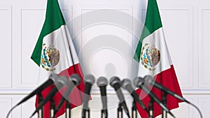 Mexican official press conference. Flags of Mexico and microphones. Conceptual 3D rendering