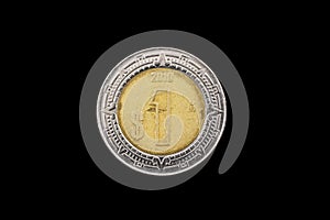 Mexican One Peso Coin Isolated On A Black Background photo