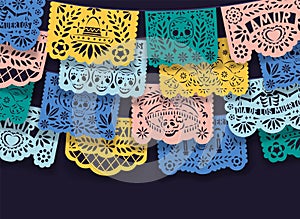 Mexican papel picado, pecked paper laces hanging on string. Mexico decoration for Dia de los Muertos means Day of Dead photo