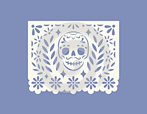 Mexican papel picado, perforated paper flag with cut pattern of skull. Traditional pecked banner for Mexico holiday of photo