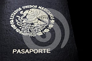Mexican passport in a black background photo
