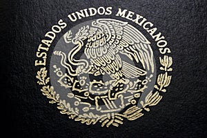 Mexican passport in a black background photo