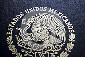 Mexican passport in a black background photo