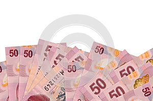 50 Mexican pesos bills lies on bottom side of screen isolated on white background with copy space. Background banner template photo