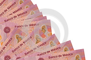 50 mexican pesos bills lies isolated on white background with copy space stacked in fan close up photo